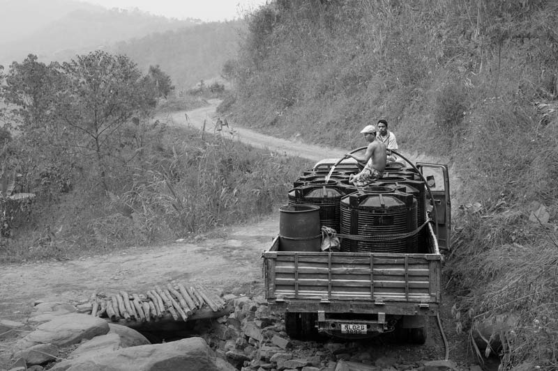 Human Right to Water in Nagaland - Tanks for private water supply being filled from a spring in Kohima district